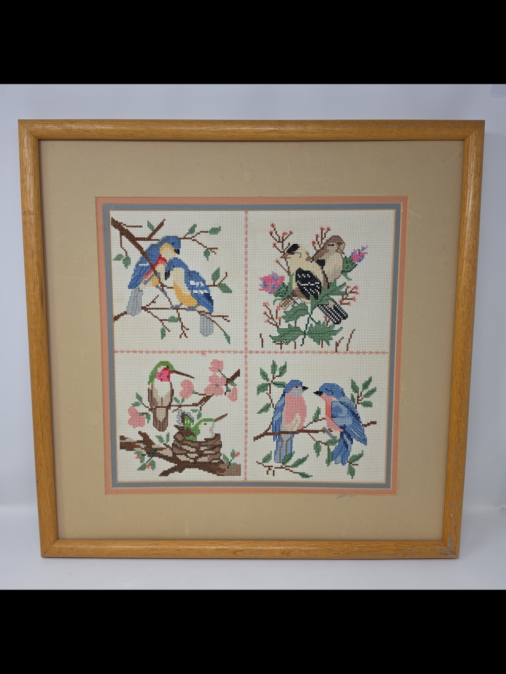 Framed Four-Panel Bird Cross-Stitch Wall Art in Blue, Pink & Green